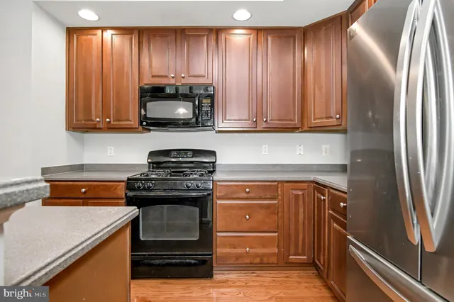 a view of a room with wooden floor and windows