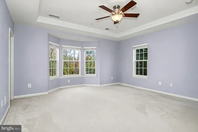 a bathroom with a sink a mirror a bathtub and shower