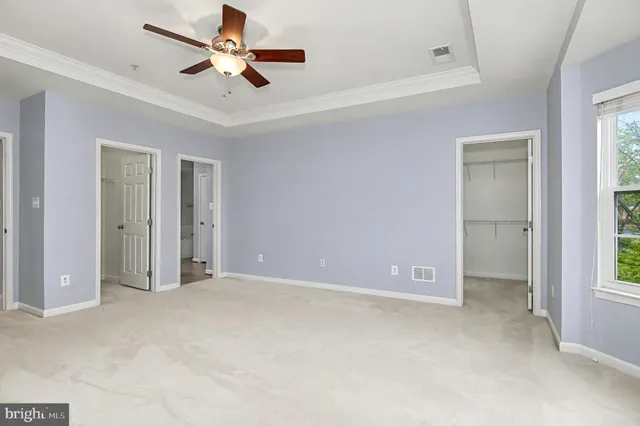 a car parked in front of a white building