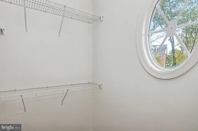 a front view of a building with a garden