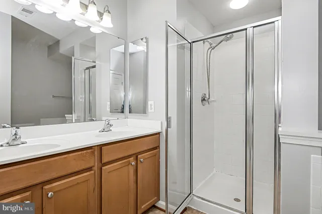 a living room with furniture and potted plant