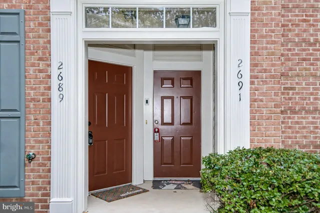 a kitchen with kitchen island a counter top space stainless steel appliances and cabinets