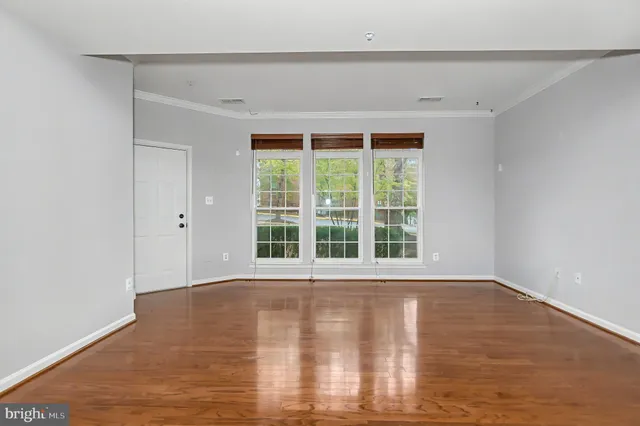 a view of kitchen with stainless steel appliances a refrigerator and a microwave