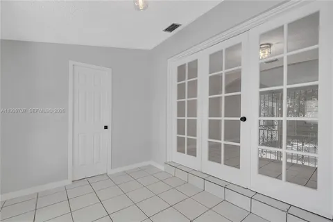 a view of empty room with windows