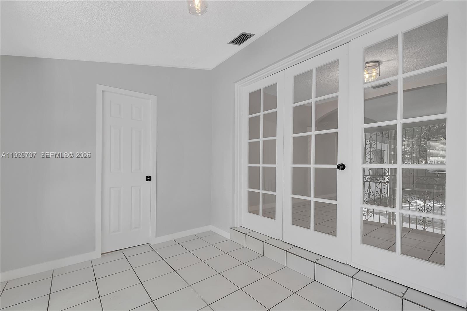 2327 Southwest 22nd Terrace, Unit FRONT Miami, FL 33145 - Photo 14 of 29 a view of empty room with windows