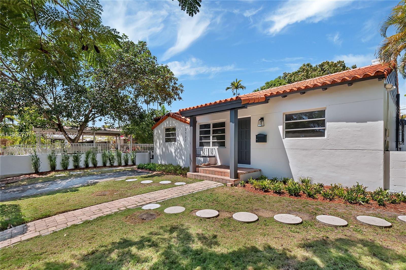 2327 Southwest 22nd Terrace, Unit FRONT Miami, FL 33145 - Photo 2 of 29 a view of a backyard with plants and patio