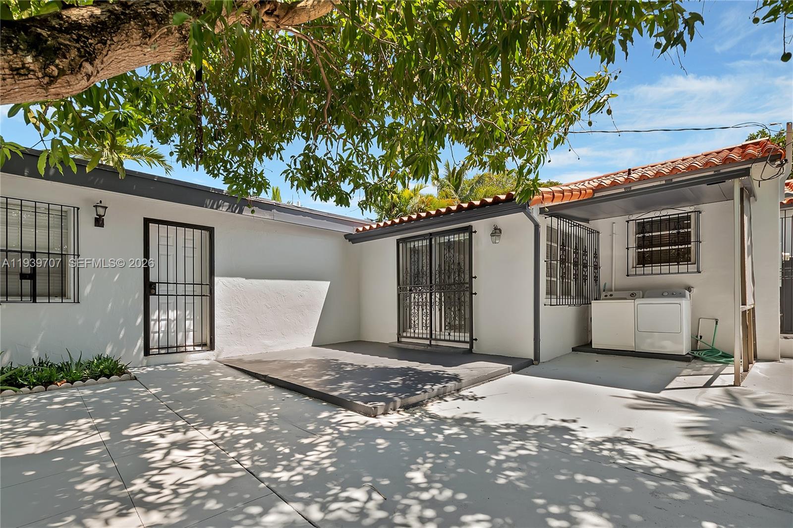 2327 Southwest 22nd Terrace, Unit FRONT Miami, FL 33145 - Photo 26 of 29 a front view of a house with a garage