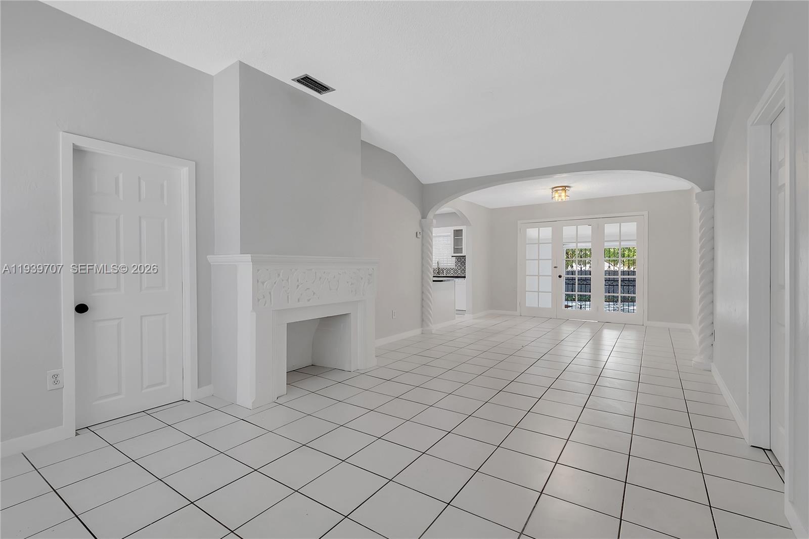 2327 Southwest 22nd Terrace, Unit FRONT Miami, FL 33145 - Photo 4 of 29 a view of an empty room and window