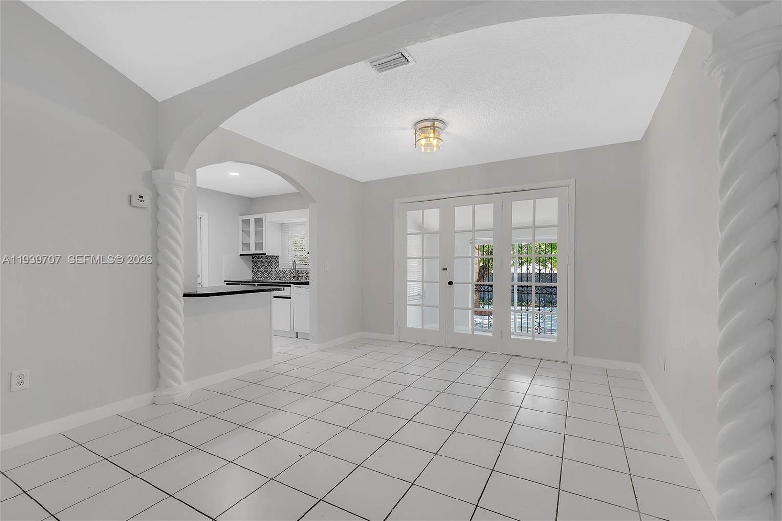 2327 Southwest 22nd Terrace, Unit FRONT Miami, FL 33145 - Photo 6 of 29 a view of an empty room with a kitchen