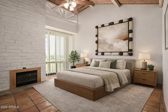 a bedroom with a bed and a fireplace