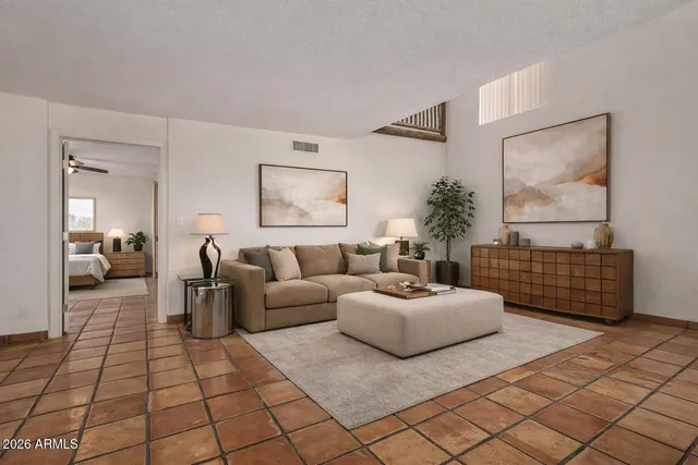 a living room with furniture and a rug