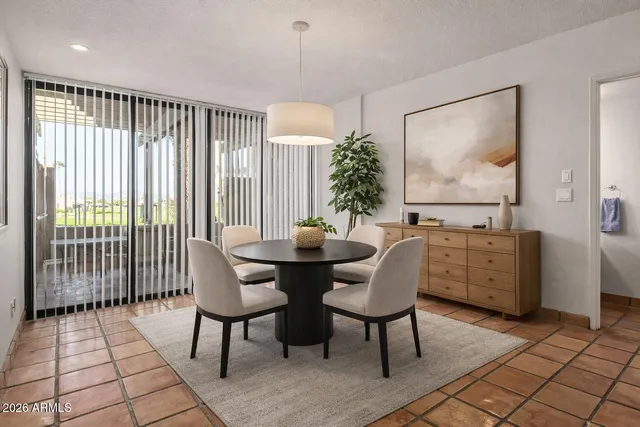 a view of a dining room with furniture window and outside view