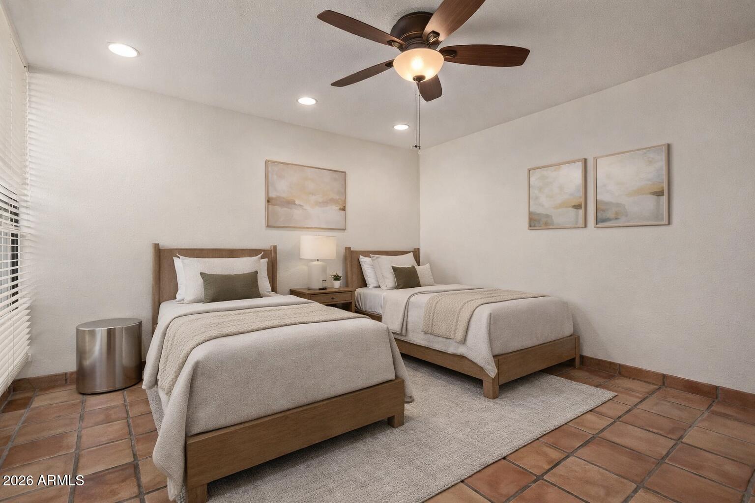 7401 North Scottsdale Road, Unit 49 Paradise Valley, AZ 85253 - Photo 6 of 7 a bedroom with two beds and painting on the wall