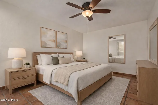 a bedroom with bed and window