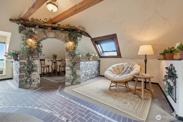 a bedroom with furniture and a chair