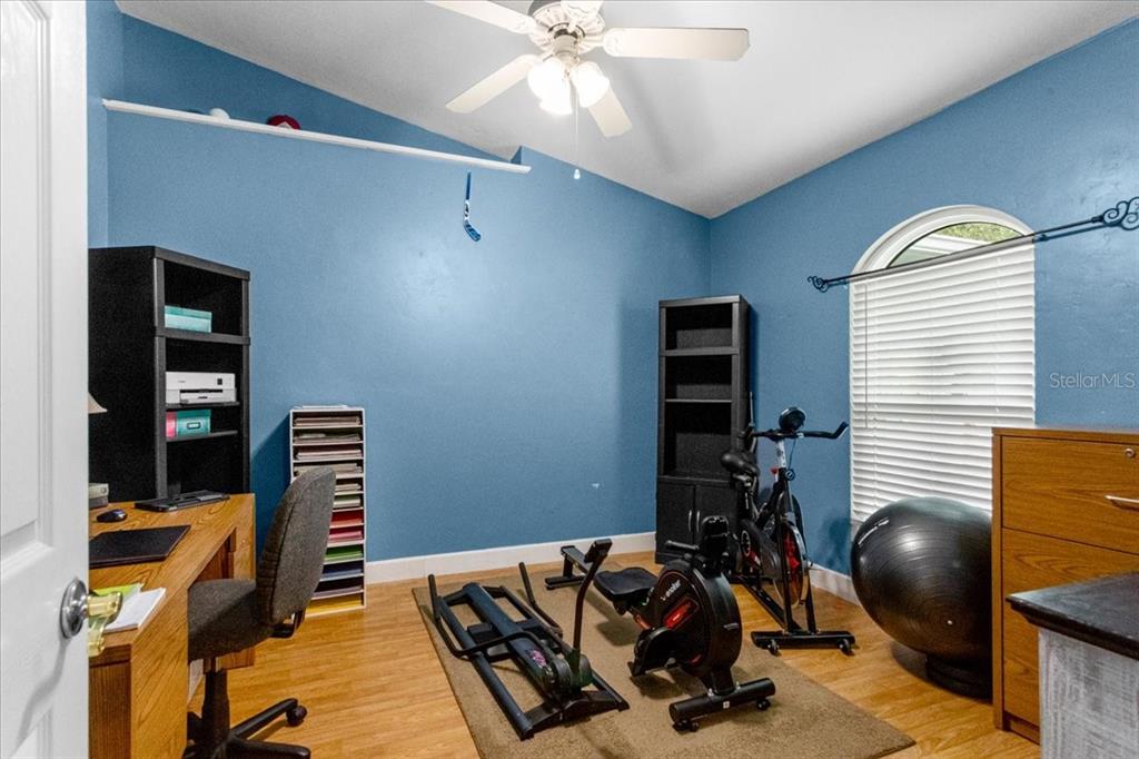 7203 Northwest 121st Avenue Alachua, FL 32615 - Photo 13 of 37 a room with furniture and musical instruments