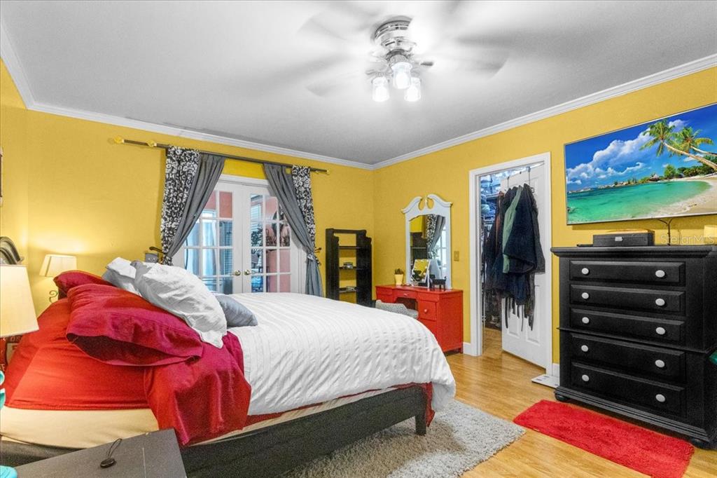 7203 Northwest 121st Avenue Alachua, FL 32615 - Photo 15 of 37 a bedroom with a bed and a flat screen tv