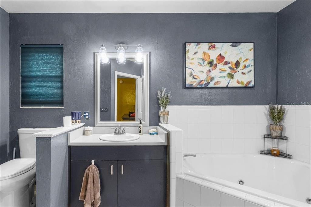 7203 Northwest 121st Avenue Alachua, FL 32615 - Photo 17 of 37 a bathroom with a sink and a mirror