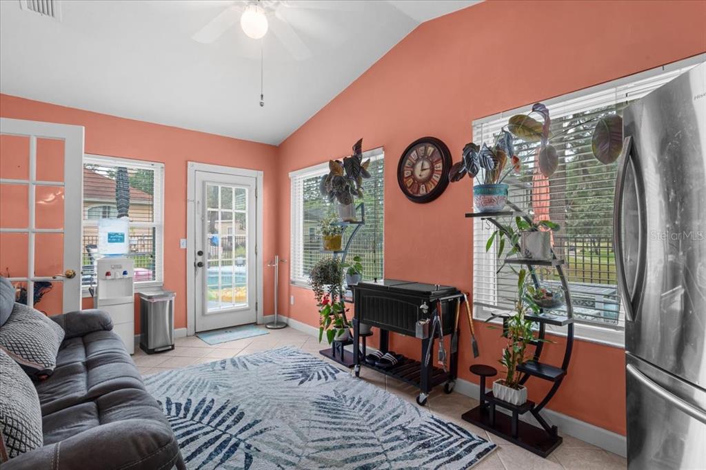 7203 Northwest 121st Avenue Alachua, FL 32615 - Photo 23 of 37 a living room with furniture and a fireplace