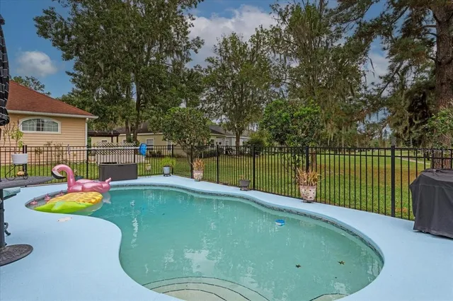 a view of a swimming pool with a slide