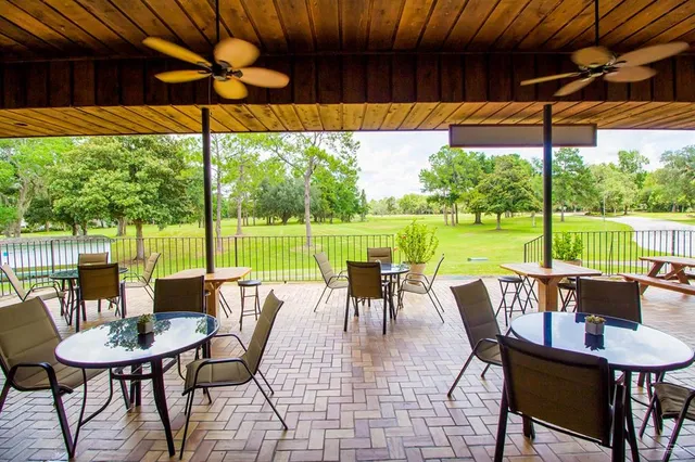 a view of a patio with a table chairs and a table