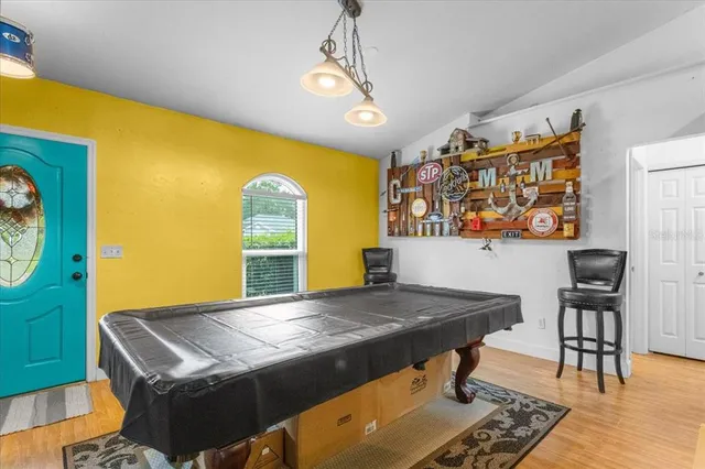 a living room with a table and chairs