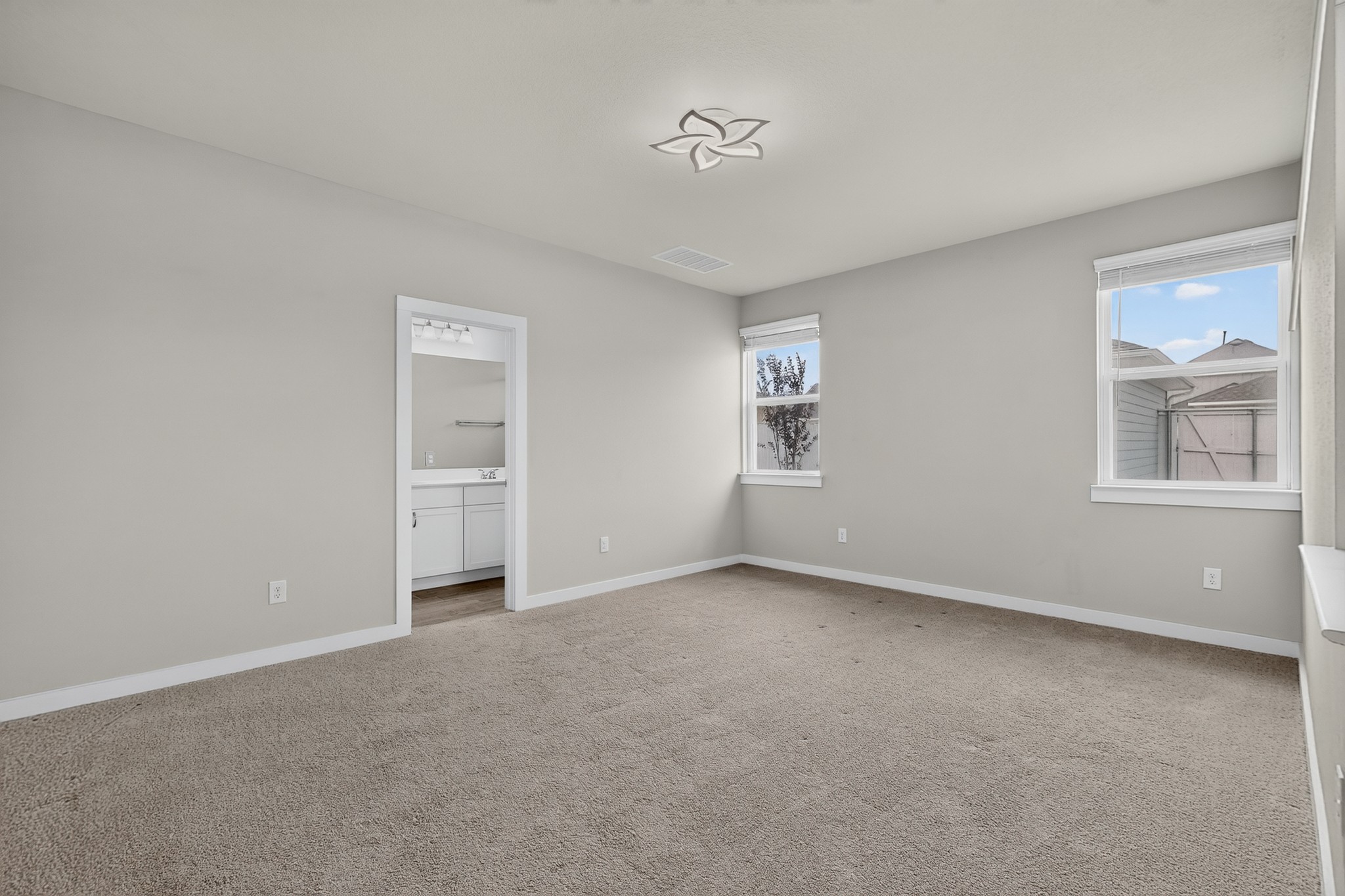116 Appleberry Lane Elgin, TX 78621 - Photo 13 of 35 A spacious, naturally illuminated room featuring plush carpeting and a bright ceiling light fixture.