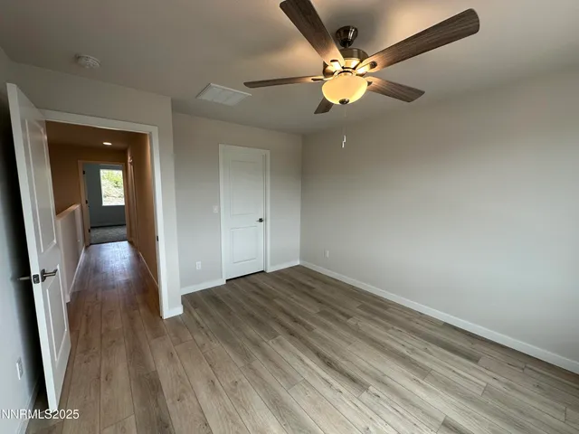 a bathroom with a tub and toilet