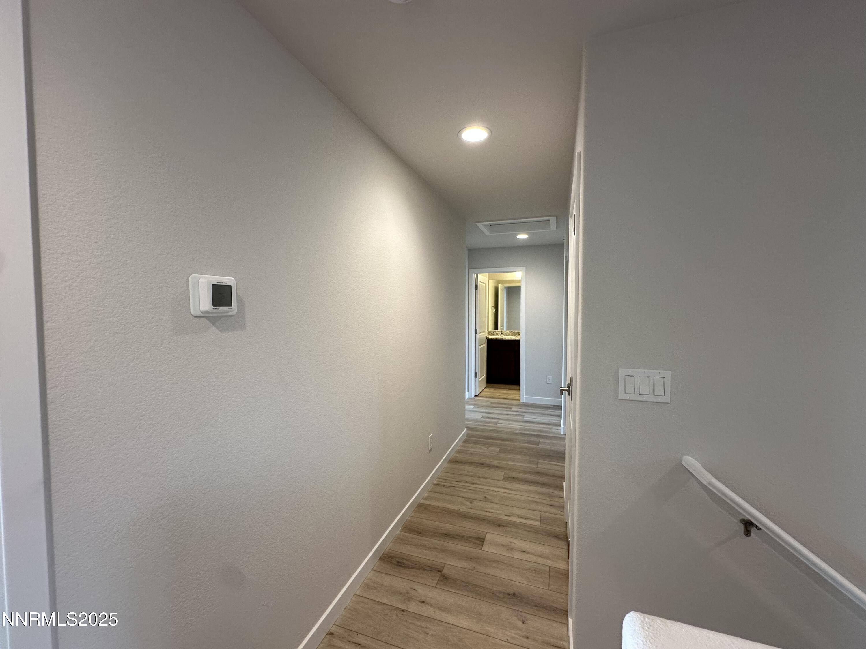 1180 Arrastra Road Reno, NV 89512 - Photo 28 of 48 a view of a hallway with wooden floor and staircase
