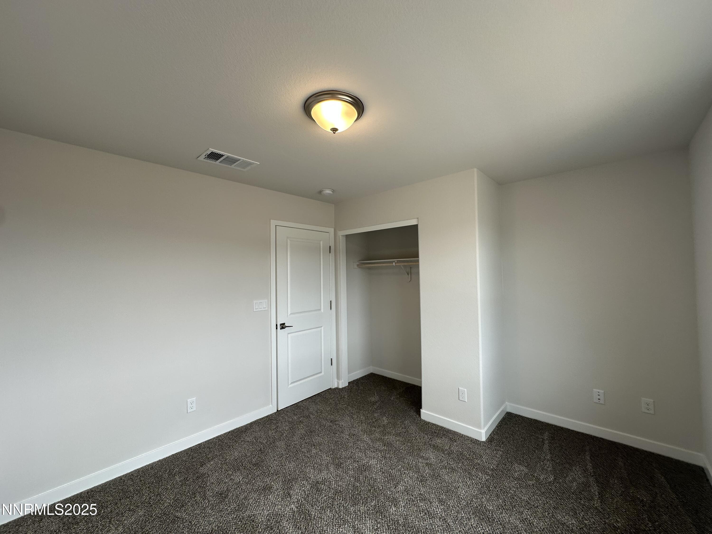 1180 Arrastra Road Reno, NV 89512 - Photo 31 of 48 an empty room with a empty space and window