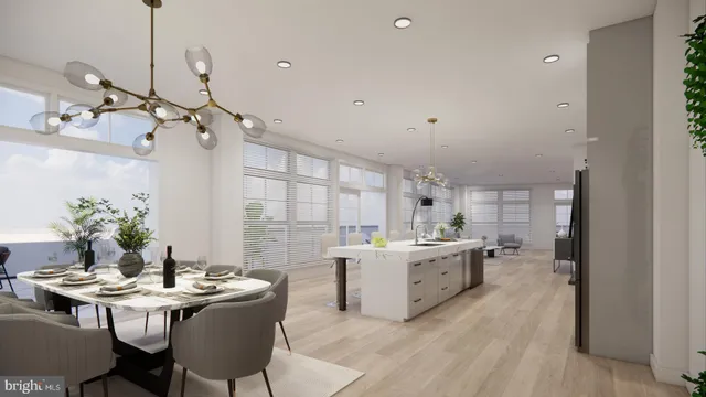 a kitchen with a stove a table and chairs in it