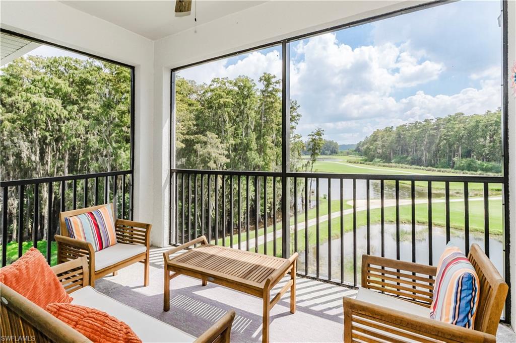 6034 National Boulevard, Unit 542 Ave Maria, FL 34142 - Photo 1 of 36 a living room with furniture and a large window