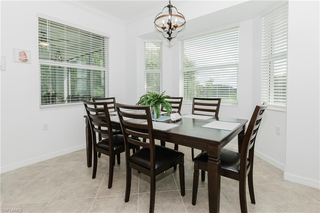 6034 National Boulevard, Unit 542 Ave Maria, FL 34142 - Photo 6 of 36 a view of a dining room with furniture window and outside view