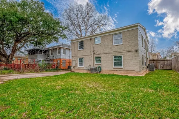 a front view of house with yard and outdoor seating