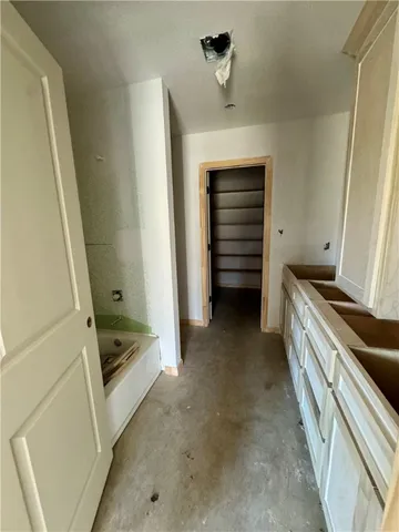 a kitchen with a refrigerator and stove