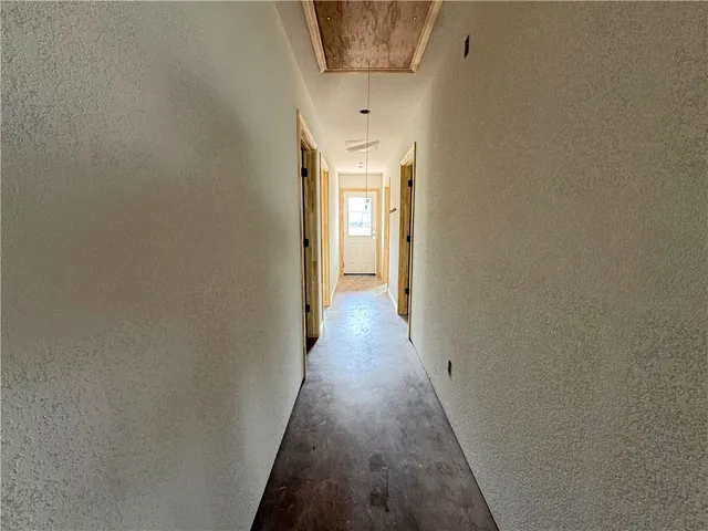 a hallway with wooden floor