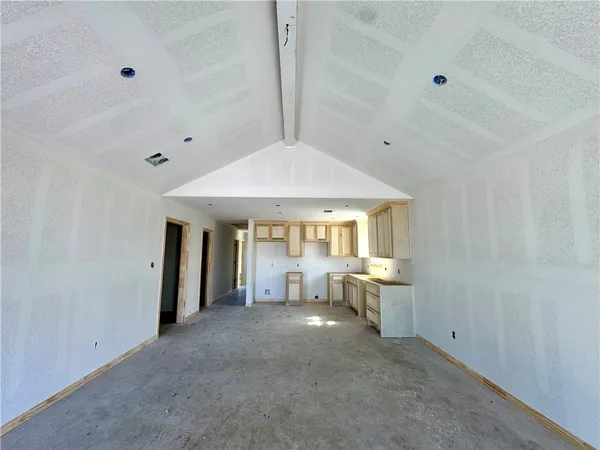 a view of a livingroom with furniture and a window