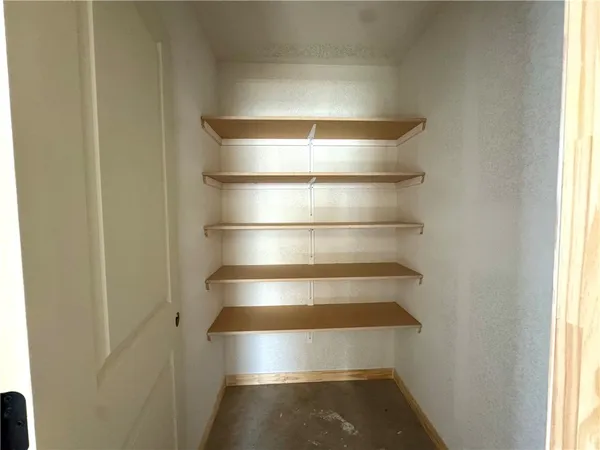a view of room with empty cabinets