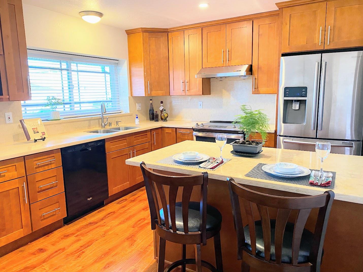1642 Matson Drive San Jose, CA 95124 - Photo 5 of 15 a kitchen with stainless steel appliances granite countertop a sink a stove a table and chairs