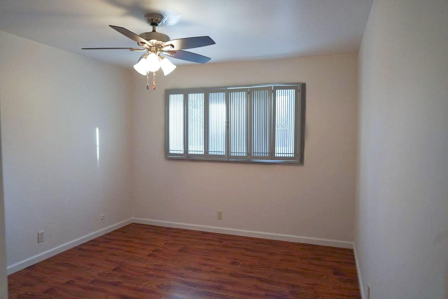 1642 Matson Drive San Jose, CA 95124 - Photo 7 of 15 a view of an empty room with wooden floor and a ceiling fan