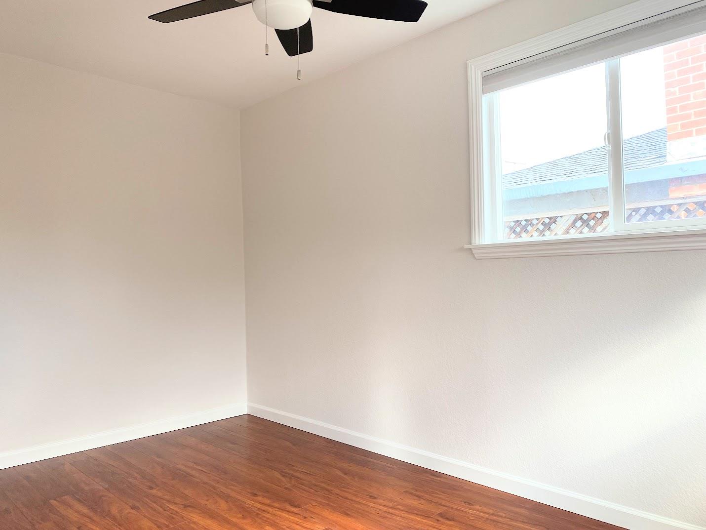 1642 Matson Drive San Jose, CA 95124 - Photo 8 of 15 an empty room with wooden floor and windows