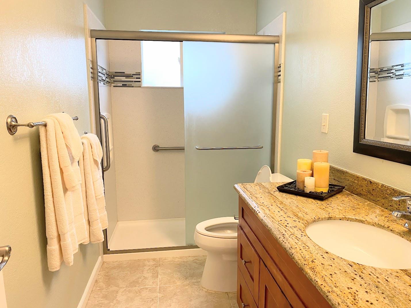 1642 Matson Drive San Jose, CA 95124 - Photo 9 of 15 a bathroom with a granite countertop sink a toilet and shower