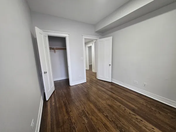 a view of front door with wooden floor