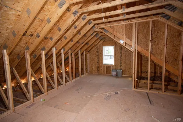 a view of an empty room with windows