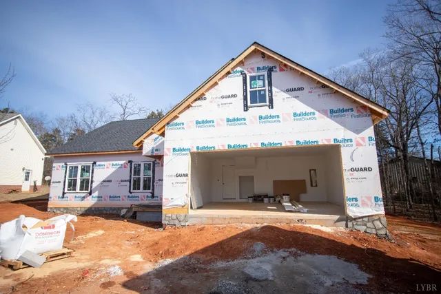 a view of a house with snow on the background
