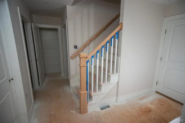 a view of a hallway with staircase