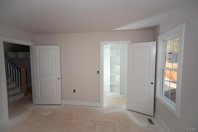 a view of an empty room and window