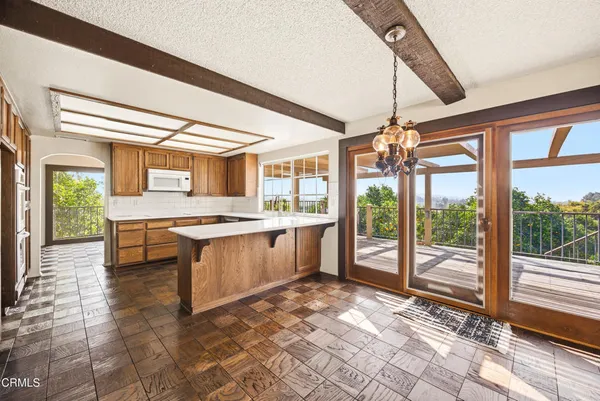 a room with window and chandelier