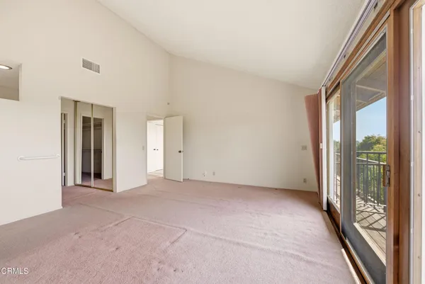 a large kitchen with a sink and large window