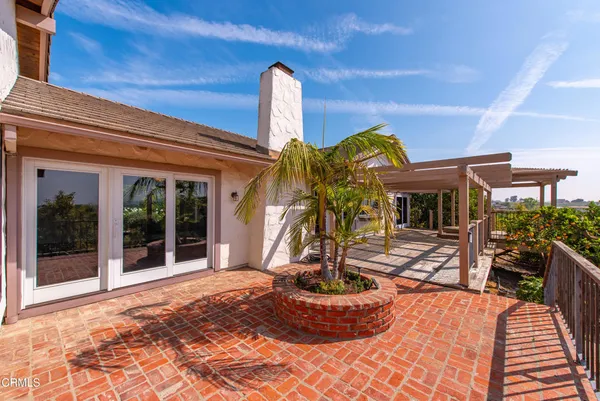 a view of a patio with wooden floor